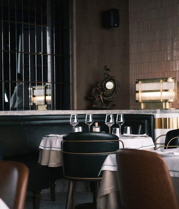 Luxurious restaurant dining area with refined table settings and ambient atmosphere