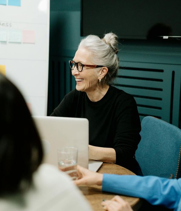 Professional team meeting in modern conference room discussing restaurant strategy