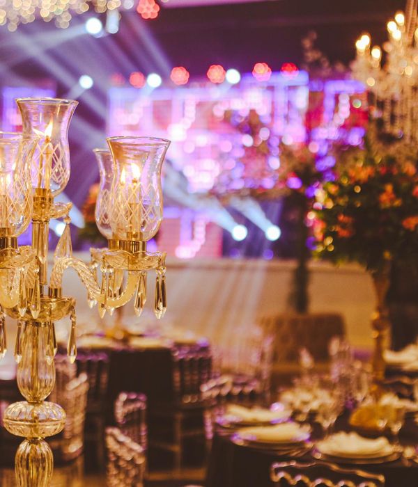 Upscale fine dining restaurant with elegant table arrangements and crystal chandeliers